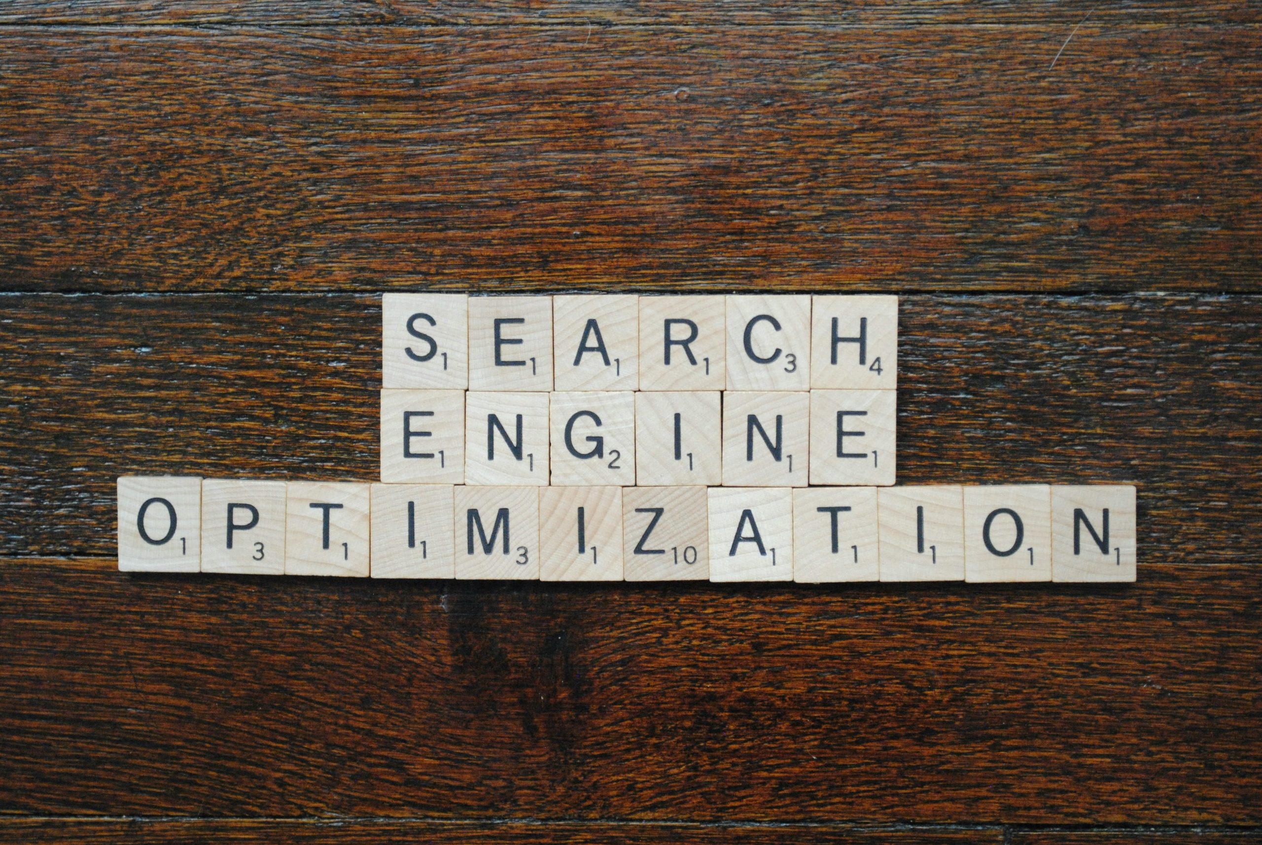 Photograph of wooden letter tiles spelling out "search engine optimization"