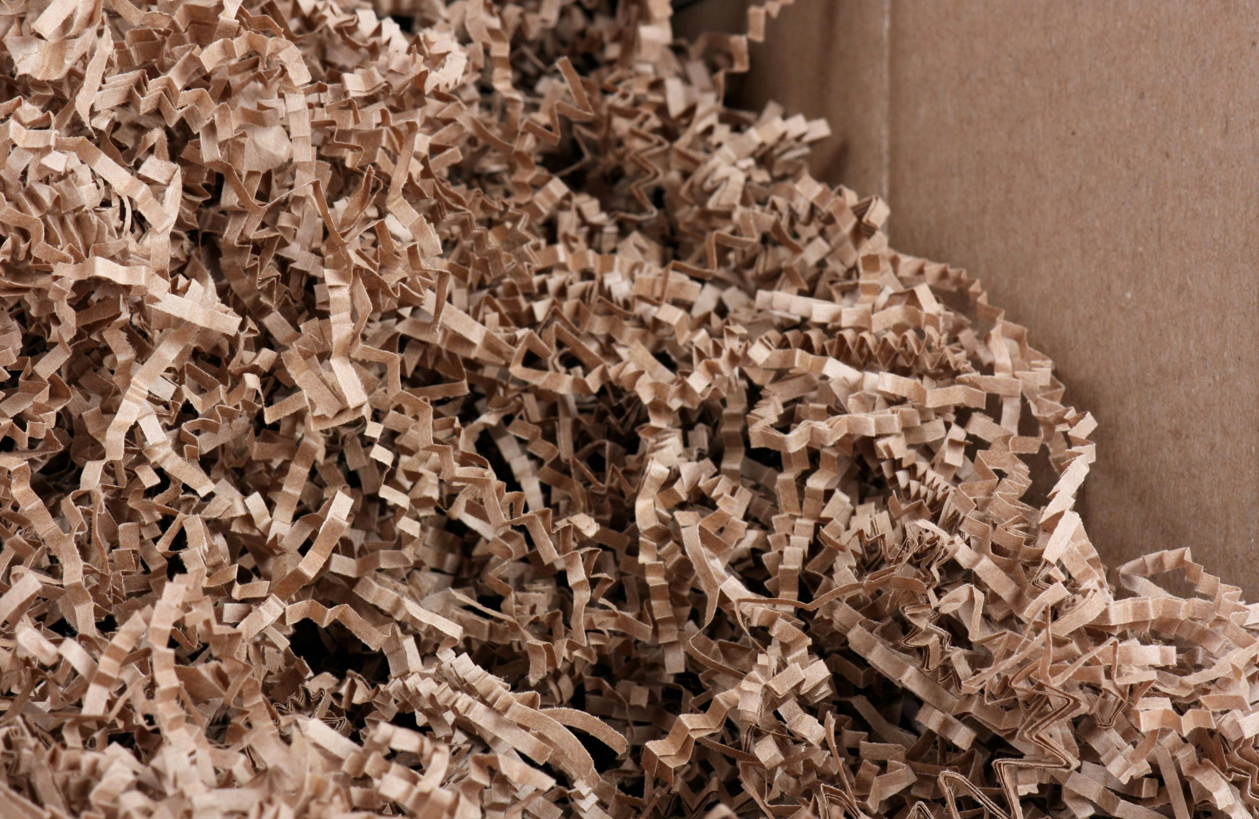 A pile of brown shredded paper