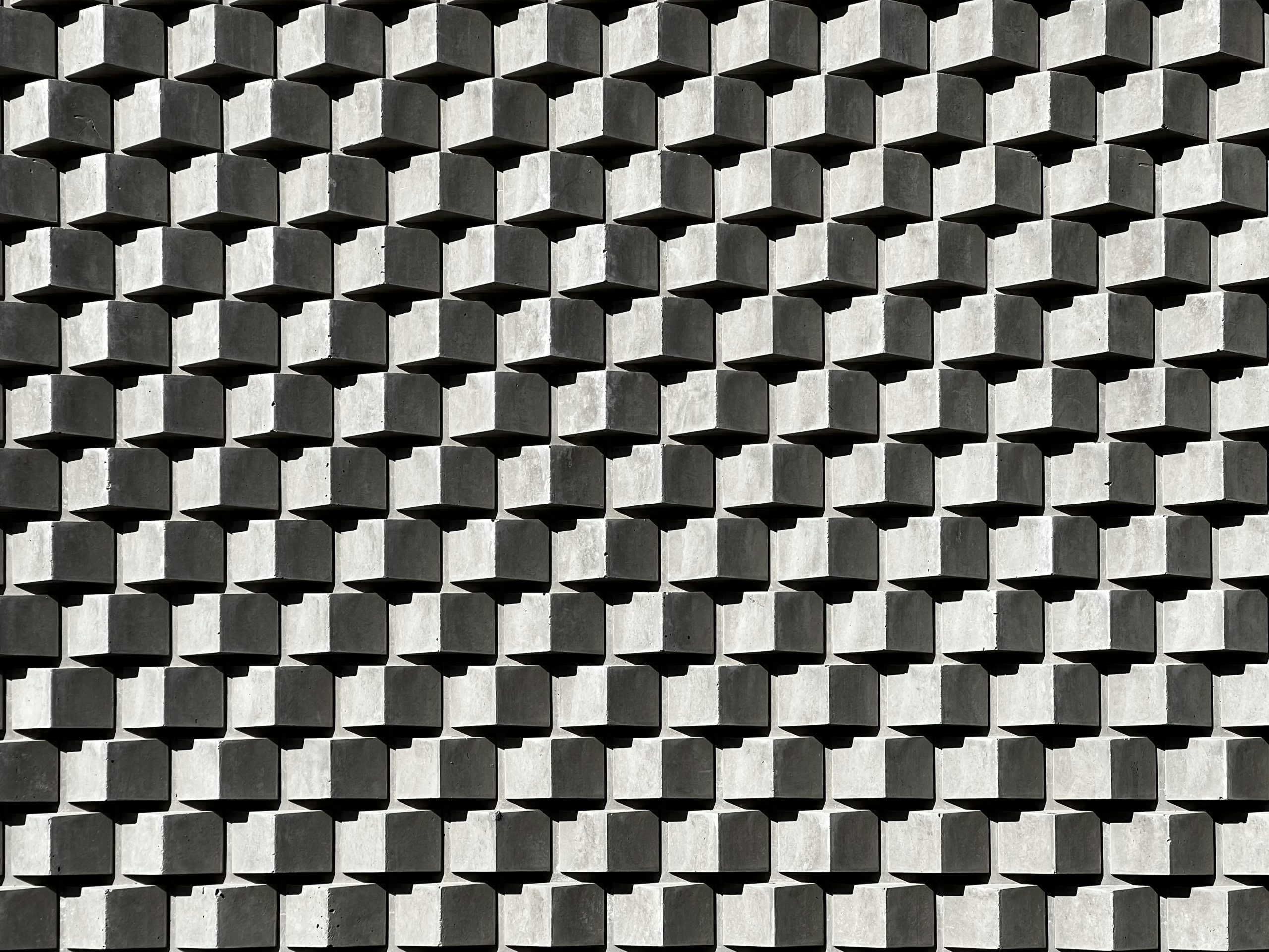 Photograph of a repeating pattern on a concrete wall